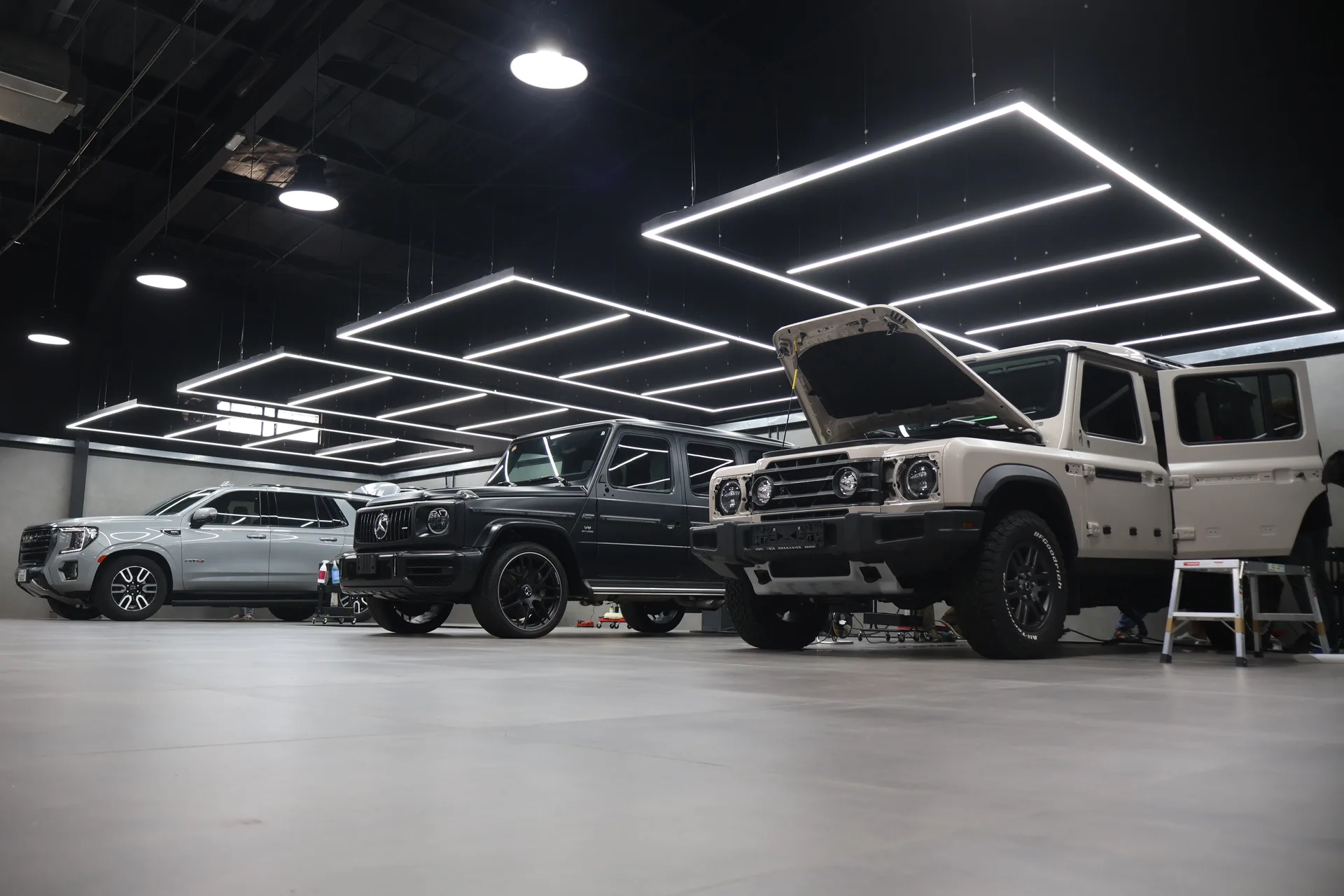 Nuvik studio with vehicles under LED inspection lighting